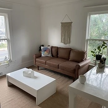 The therapy room at the Reno office, with a comfortable sofa and warm natural light