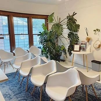 The welcoming waiting area at the Reno office, with natural light, comfortable seating, and plants